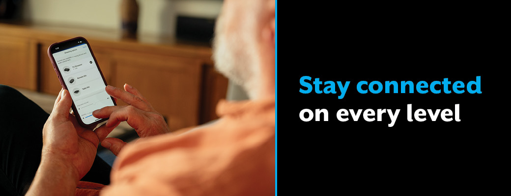Image of middle aged man on his smart phone beside text that promotes staying connnected on every level
